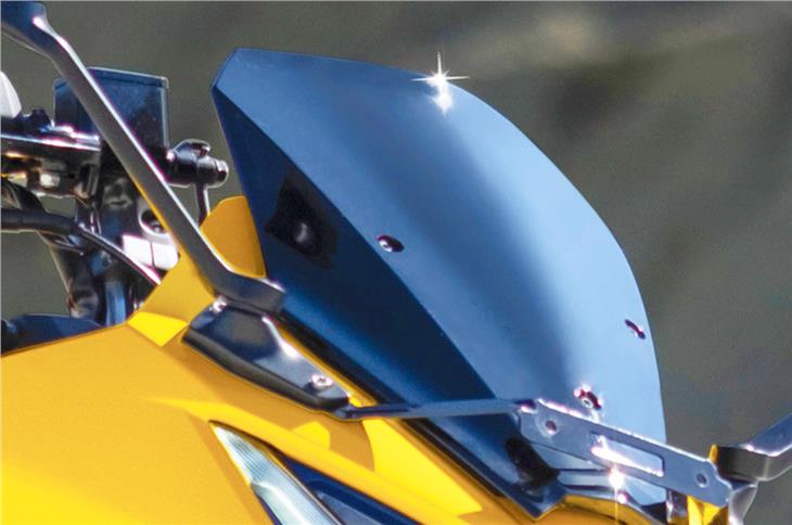 An adjustable windscreen is found on the Karizma XMR, a segment-first.